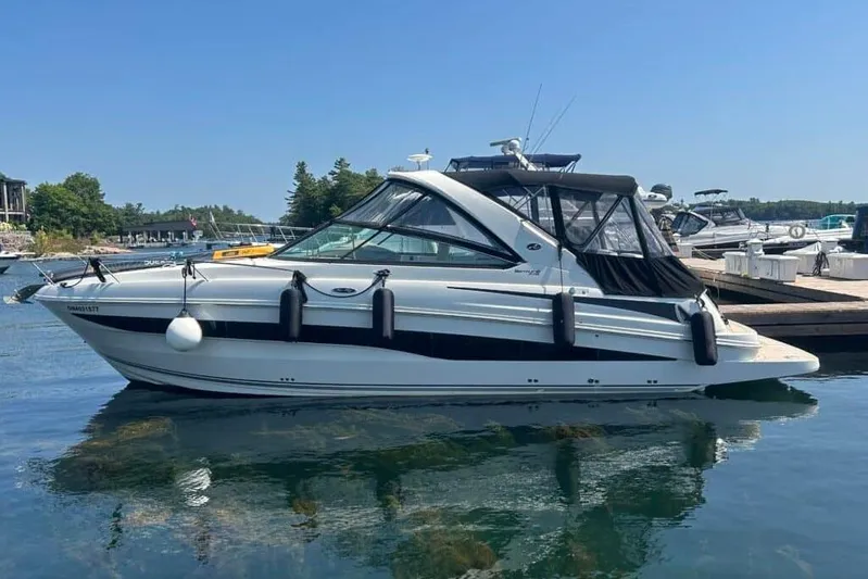  Yacht Photos Pics 2013 Searay 370 Venture boat docked on calm water, clear sky background.