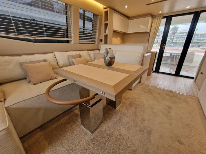 Sandrali Yacht Photos Pics Luxurious interior of 2016 Beneteau Monte Carlo 6 yacht with elegant seating and modern decor.