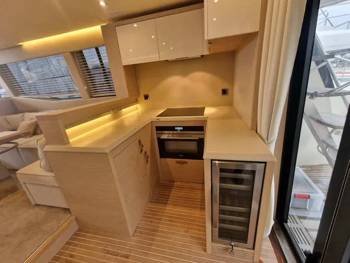 Sandrali Yacht Photos Pics Luxurious kitchen interior of 2016 Beneteau Monte Carlo 6 yacht with modern appliances.