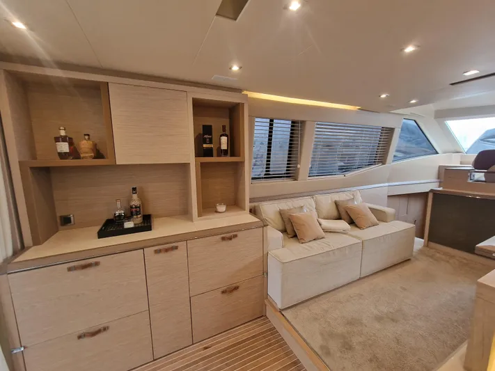 Sandrali Yacht Photos Pics Luxurious interior of 2016 Beneteau Monte Carlo 6 yacht with elegant seating and cabinetry.