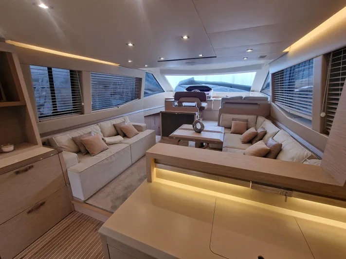 Sandrali Yacht Photos Pics Luxurious interior of 2016 Beneteau Monte Carlo 6 yacht with modern furnishings and ample seating.