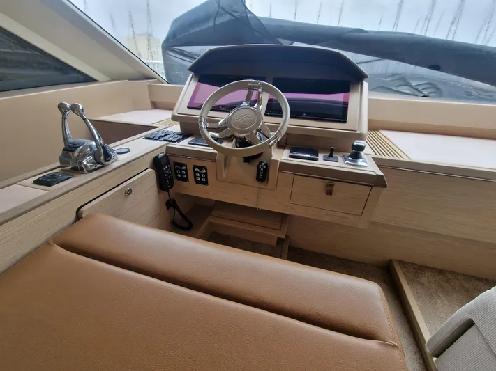 Sandrali Yacht Photos Pics Helm station of 2016 Beneteau Monte Carlo 6 yacht with modern controls and steering wheel.