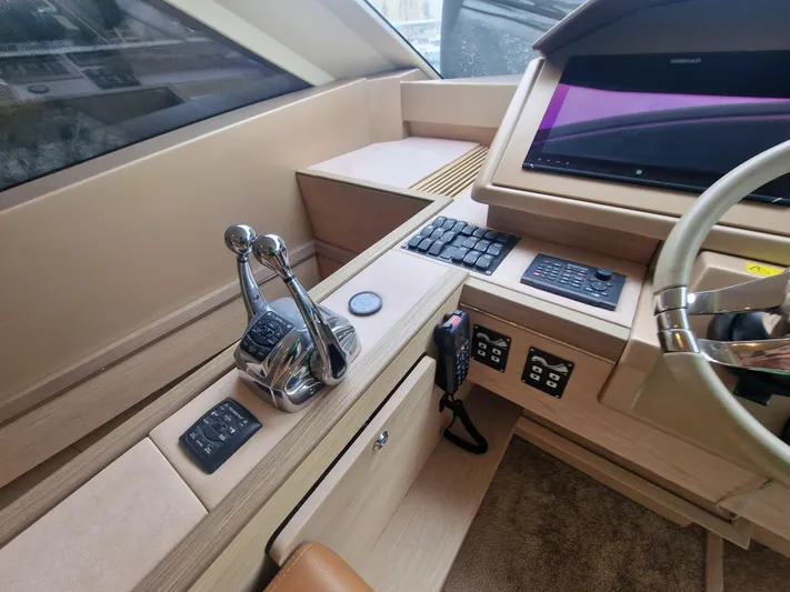 Sandrali Yacht Photos Pics Helm station of 2016 Beneteau Monte Carlo 6 yacht with modern controls and navigation equipment.