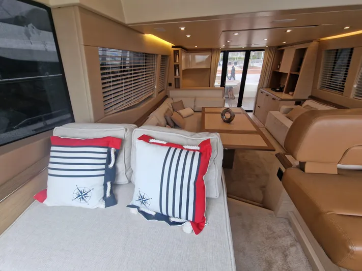 Sandrali Yacht Photos Pics Luxurious interior of 2016 Beneteau Monte Carlo 6 yacht with stylish seating and nautical decor.