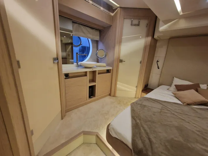 Sandrali Yacht Photos Pics Luxurious interior of 2016 Beneteau Monte Carlo 6 yacht, featuring elegant bedroom and vanity area.