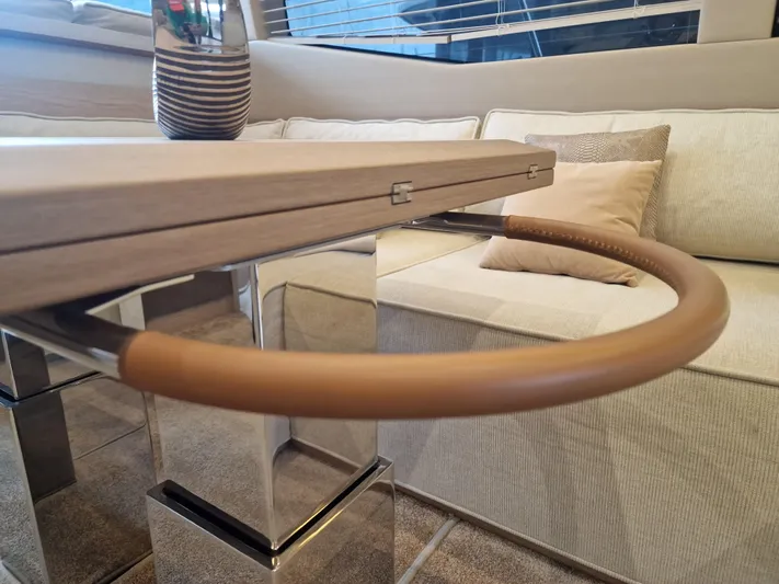 Sandrali Yacht Photos Pics Luxurious interior of 2016 Beneteau Monte Carlo 6 yacht with elegant seating and table design.