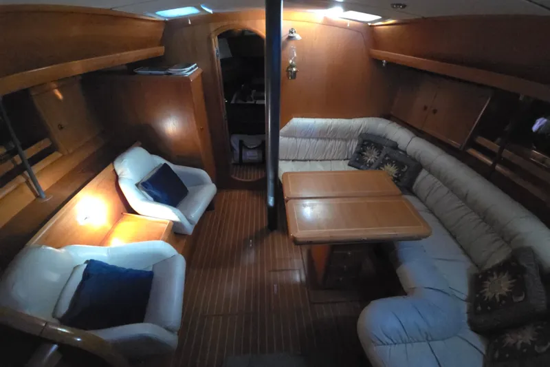 Luthien Yacht Photos Pics Interior of 1998 Jeanneau Sun Odyssey 42 with cozy seating area.