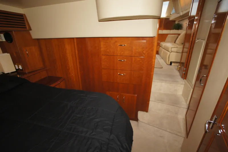 Debra Lynn Yacht Photos Pics Luxurious interior of 2005 Carver 44 Cockpit Motor Yacht with wood cabinetry and cozy seating.