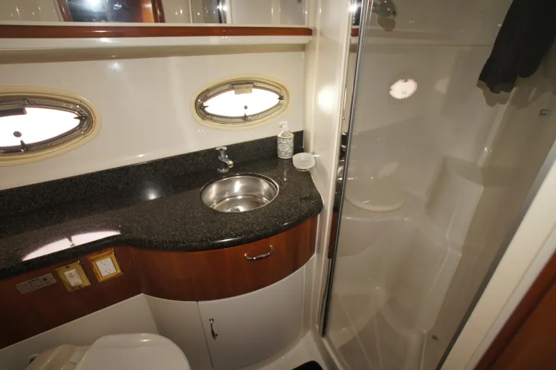 Debra Lynn Yacht Photos Pics Bathroom interior of 2005 Carver 44 Cockpit Motor Yacht with sink and shower.
