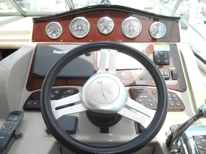 Legasea Yacht Photos Pics Steering wheel and dashboard of 2013 Sea Ray 330 Sundancer boat.