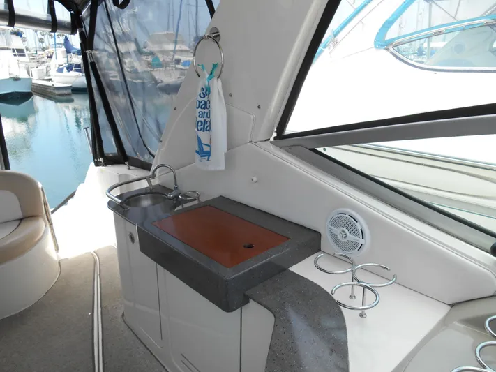 Legasea Yacht Photos Pics 2013 Sea Ray 330 Sundancer boat interior with sink and countertop.