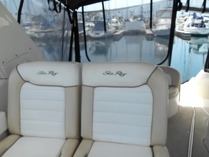 Legasea Yacht Photos Pics 2013 Sea Ray 330 Sundancer interior with marina view, featuring plush seating.