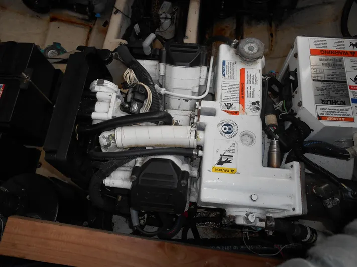 Legasea Yacht Photos Pics Engine compartment of 2013 Sea Ray 330 Sundancer boat, showcasing mechanical components.