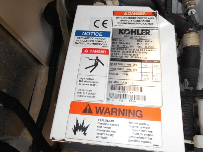 Legasea Yacht Photos Pics Kohler generator warning label on 2013 Sea Ray 330 Sundancer, highlighting safety precautions.
