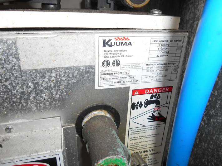 Legasea Yacht Photos Pics Kuuma water heater label on 2013 Sea Ray 330 Sundancer, showing capacity and safety warnings.