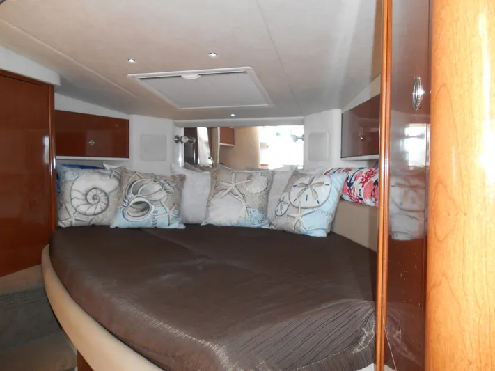 Legasea Yacht Photos Pics Cozy cabin interior of 2013 Sea Ray 330 Sundancer with decorative pillows.