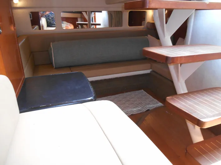 Legasea Yacht Photos Pics Interior of 2013 Sea Ray 330 Sundancer, featuring seating and wooden steps.