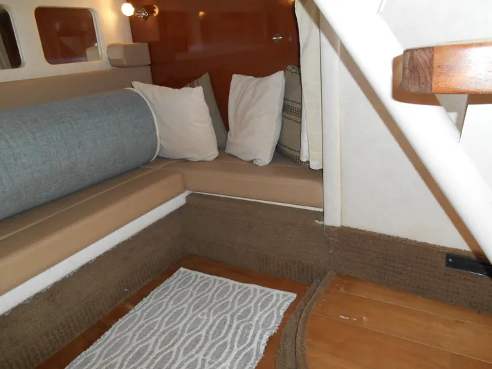 Legasea Yacht Photos Pics Interior of 2013 Sea Ray 330 Sundancer with cozy seating and cushions.