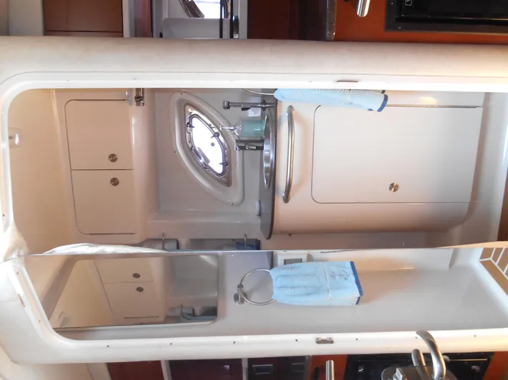 Legasea Yacht Photos Pics Interior of 2013 Sea Ray 330 Sundancer bathroom with sink and mirror.