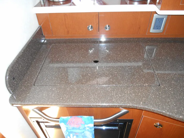 Legasea Yacht Photos Pics 2013 Sea Ray 330 Sundancer kitchen countertop with sleek design and modern cabinetry.