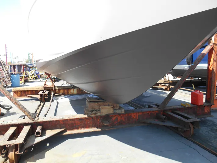 Legasea Yacht Photos Pics 2013 Sea Ray 330 Sundancer boat hull on a trailer in a shipyard.