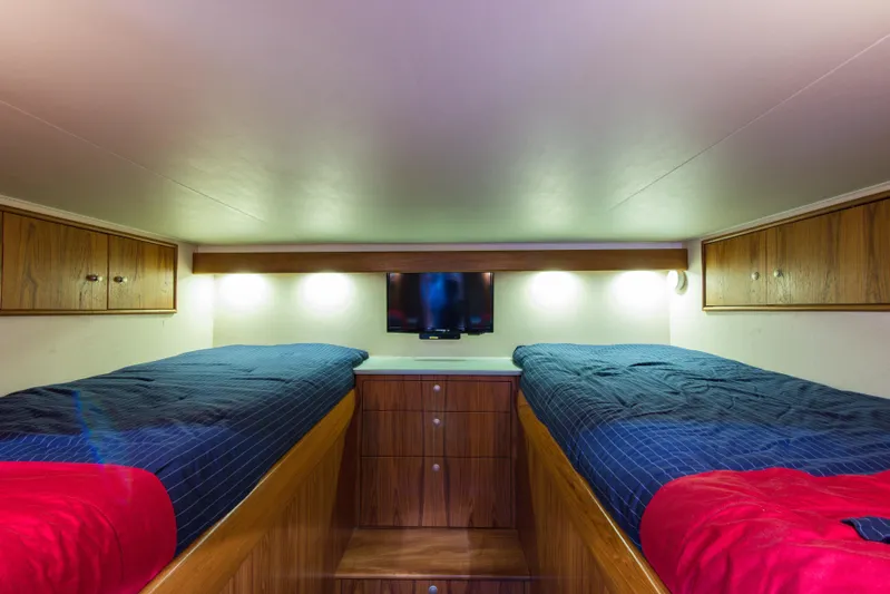 Oyster Yacht Photos Pics Twin beds in the cabin of a 2012 Custom Carolina Ritchie Howell 60 Sportfish yacht.