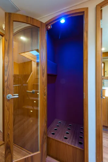 Oyster Yacht Photos Pics 2012 Custom Carolina Ritchie Howell 60 Sportfish interior with wooden doors and blue lighting.