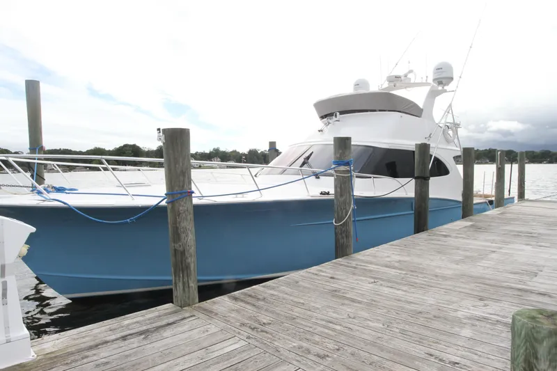 Oyster Yacht Photos Pics 2012 Custom Carolina Ritchie Howell 60 Sportfish yacht docked at a marina.