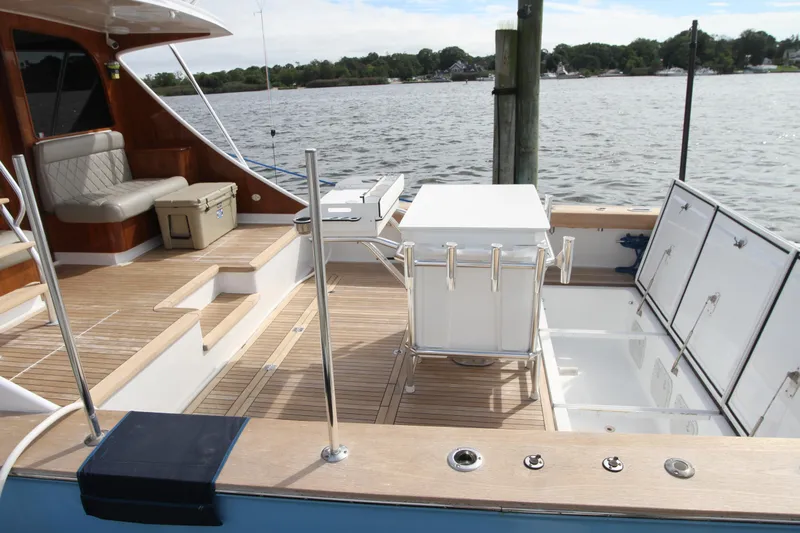 Oyster Yacht Photos Pics Custom Carolina Ritchie Howell 60 Sportfish 2012 boat deck with seating and fishing equipment.