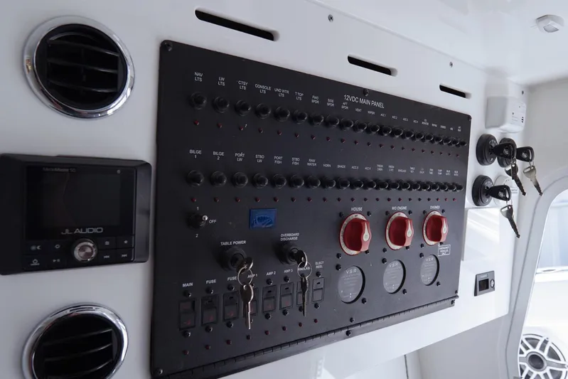  Yacht Photos Pics Control panel of 2023 Tidewater 380 CC Adventure boat with audio system and keys.