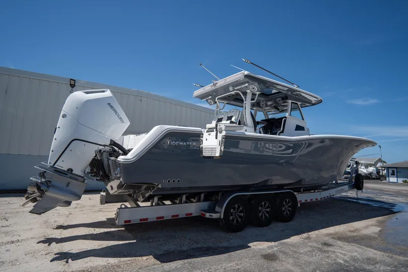  Yacht Photos Pics 2023 Tidewater 380 CC Adventure boat on trailer, featuring Mercury outboard engines.