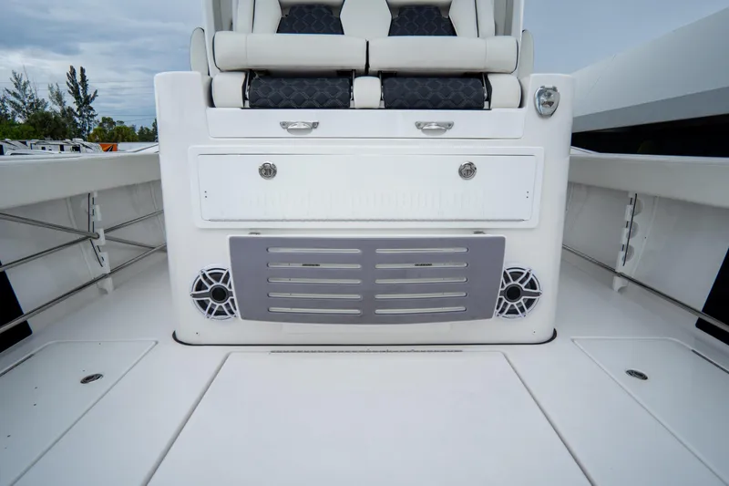  Yacht Photos Pics 2023 Tidewater 380 CC Adventure boat interior with seating and storage compartments.