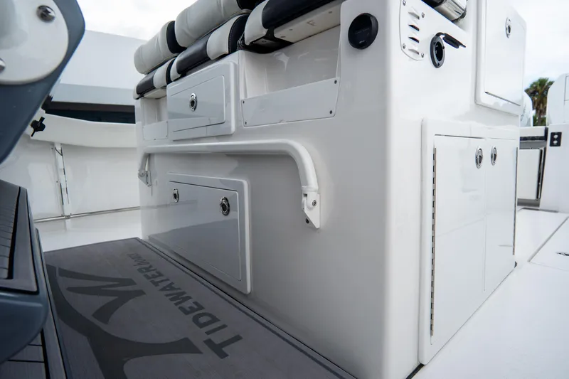  Yacht Photos Pics 2023 Tidewater 380 CC Adventure boat interior with storage compartments and seating.