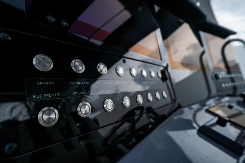  Yacht Photos Pics Control panel of 2023 Tidewater 380 CC Adventure boat with various buttons and displays.