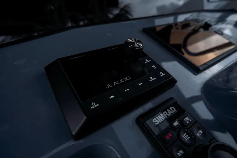  Yacht Photos Pics Control panel of 2023 Tidewater 380 CC Adventure with JL Audio and Simrad systems.