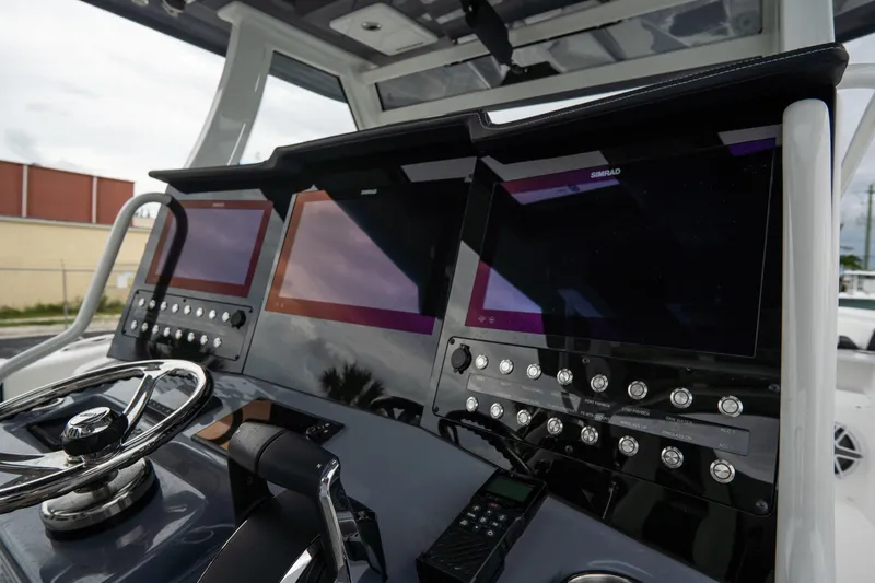  Yacht Photos Pics 2023 Tidewater 380 CC Adventure boat dashboard with advanced navigation displays and controls.