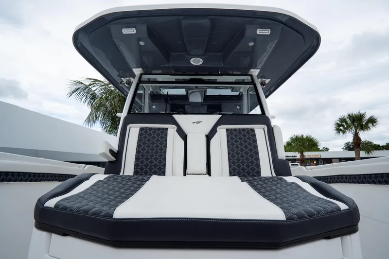  Yacht Photos Pics 2023 Tidewater 380 CC Adventure boat with luxurious seating and sleek design.