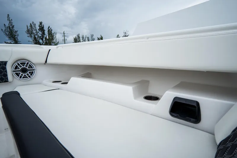  Yacht Photos Pics 2023 Tidewater 380 CC Adventure boat interior with speaker and cup holders.