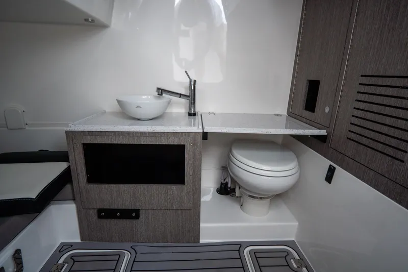  Yacht Photos Pics 2023 Tidewater 380 CC Adventure boat interior with modern sink and toilet.
