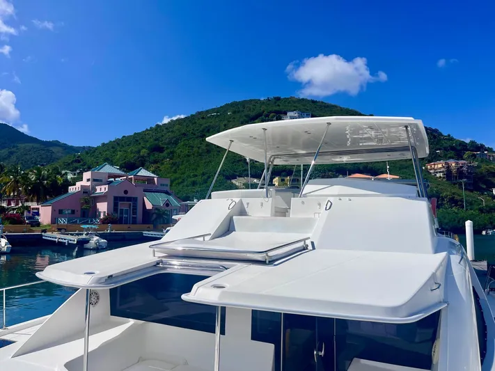 Ida Cat Yacht Photos Pics 2017 Leopard 51 Powercat yacht docked with scenic mountain backdrop.