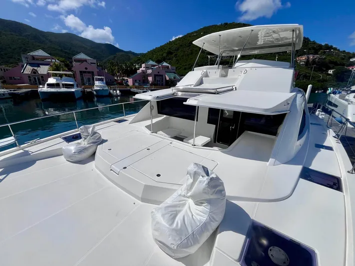 Ida Cat Yacht Photos Pics 2017 Leopard 51 Powercat yacht docked in scenic marina with lush hills and clear skies.
