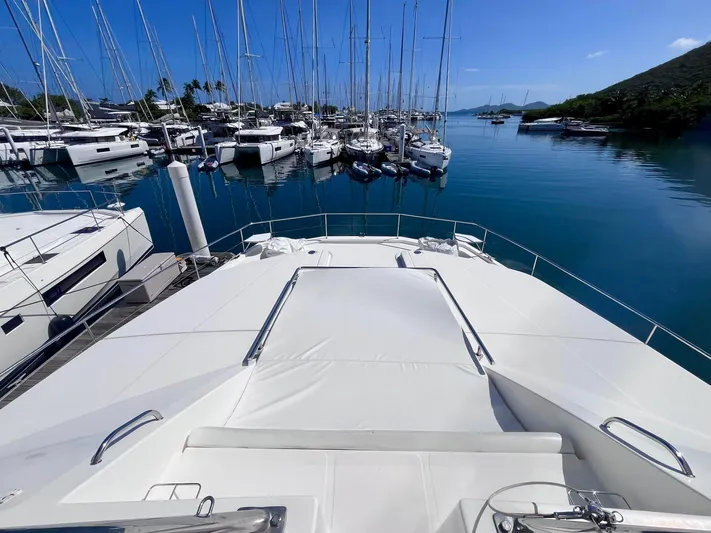 Ida Cat Yacht Photos Pics 2017 Leopard 51 Powercat yacht docked in a serene marina with clear blue water.