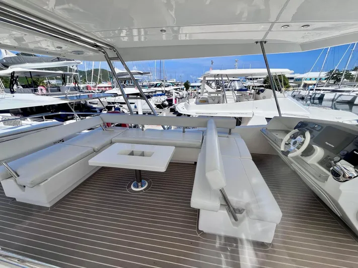 Ida Cat Yacht Photos Pics 2017 Leopard 51 Powercat yacht with spacious seating and helm, docked at a marina.