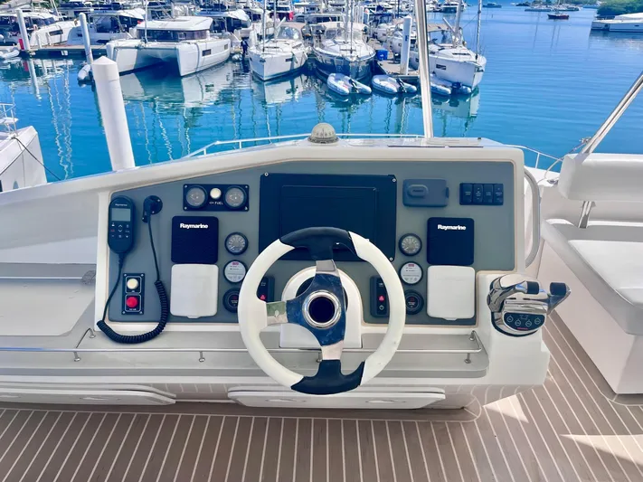 Ida Cat Yacht Photos Pics Helm of 2017 Leopard 51 Powercat with modern controls, docked at marina.