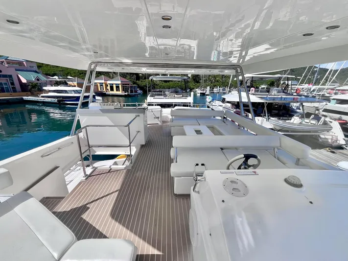 Ida Cat Yacht Photos Pics 2017 Leopard 51 Powercat yacht interior with spacious seating and helm, docked at marina.