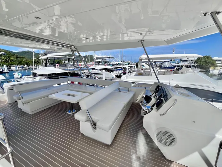 Ida Cat Yacht Photos Pics 2017 Leopard 51 Powercat yacht with spacious seating and helm, docked at a marina.