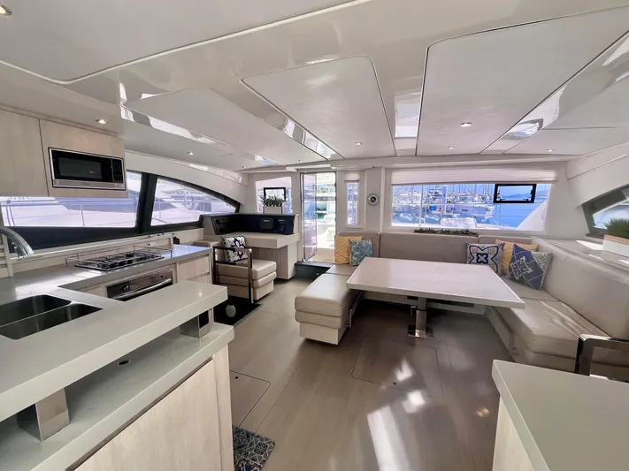Ida Cat Yacht Photos Pics Luxurious interior of 2017 Leopard 51 Powercat yacht with modern kitchen and spacious seating area.