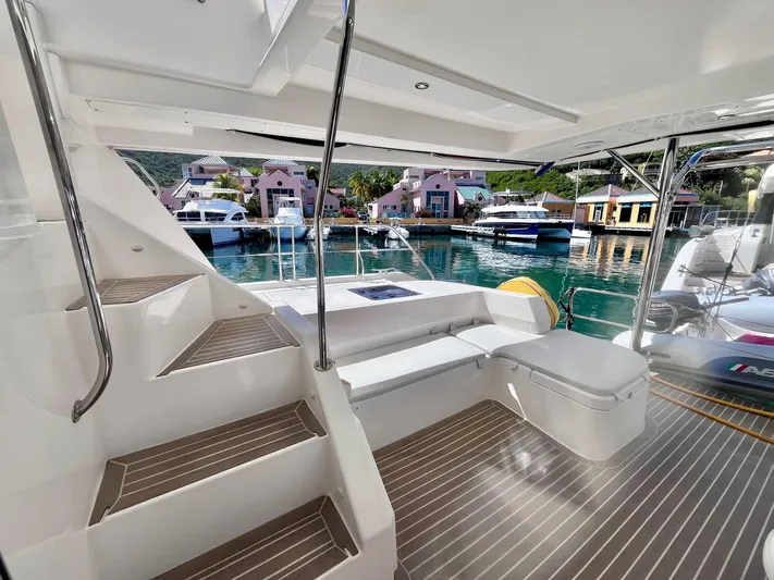 Ida Cat Yacht Photos Pics 2017 Leopard 51 Powercat yacht interior with stairs, seating, and marina view.