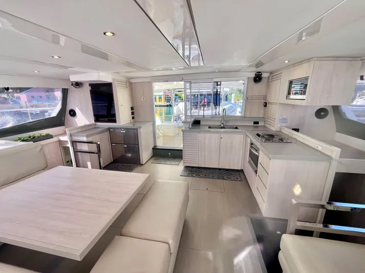 Ida Cat Yacht Photos Pics Spacious interior of 2017 Leopard 51 Powercat with modern kitchen and dining area.