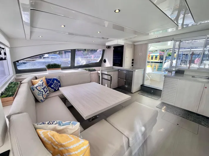 Ida Cat Yacht Photos Pics Luxurious interior of 2017 Leopard 51 Powercat with modern seating and large windows.